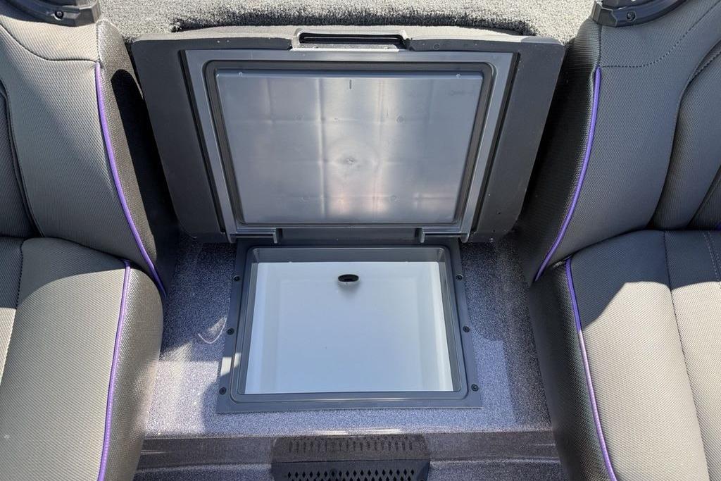 2026 Skeeter ZXE21 boat interior with open storage compartment between seats.