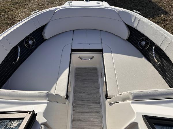 2025 Sea Ray SPX 230 OB boat interior with cushioned seating and sleek design.