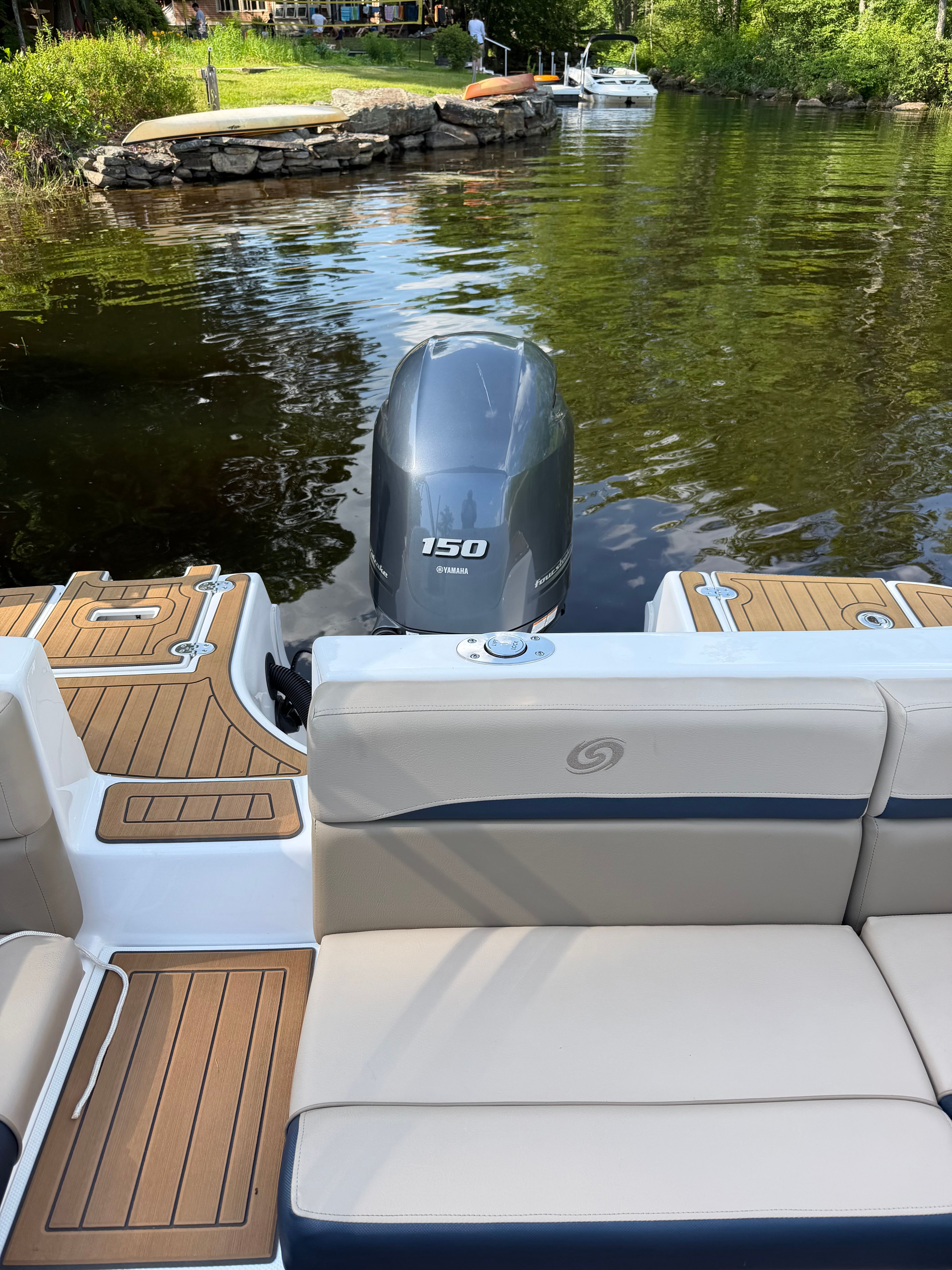 The image shows the stern of a 2022 Hurricane SunDeck 217 OB with a 150 HP outboard motor.