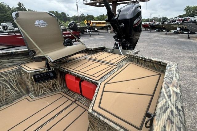 2026 Tracker Grizzly 1650 T Prairie Wings Edition boat with camo design and Mercury outboard motor.