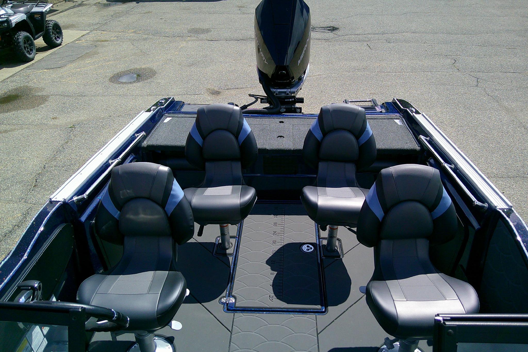 2025 Nitro ZV20 Sport boat interior with four black seats and motor.