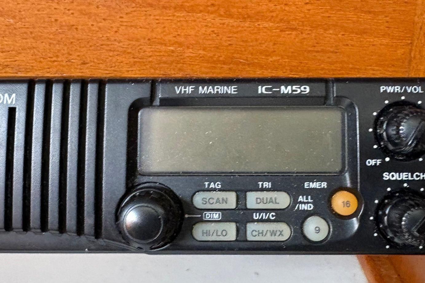 VHF marine radio IC-M59 on 1992 Catalina 34 sailboat, featuring control knobs and display.
