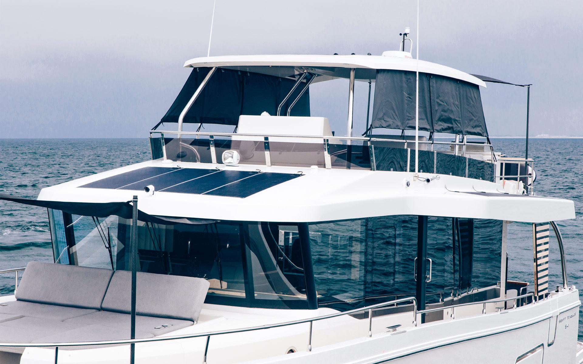 2026 Beneteau Swift Trawler 54 on open water, showcasing modern design and spacious deck.