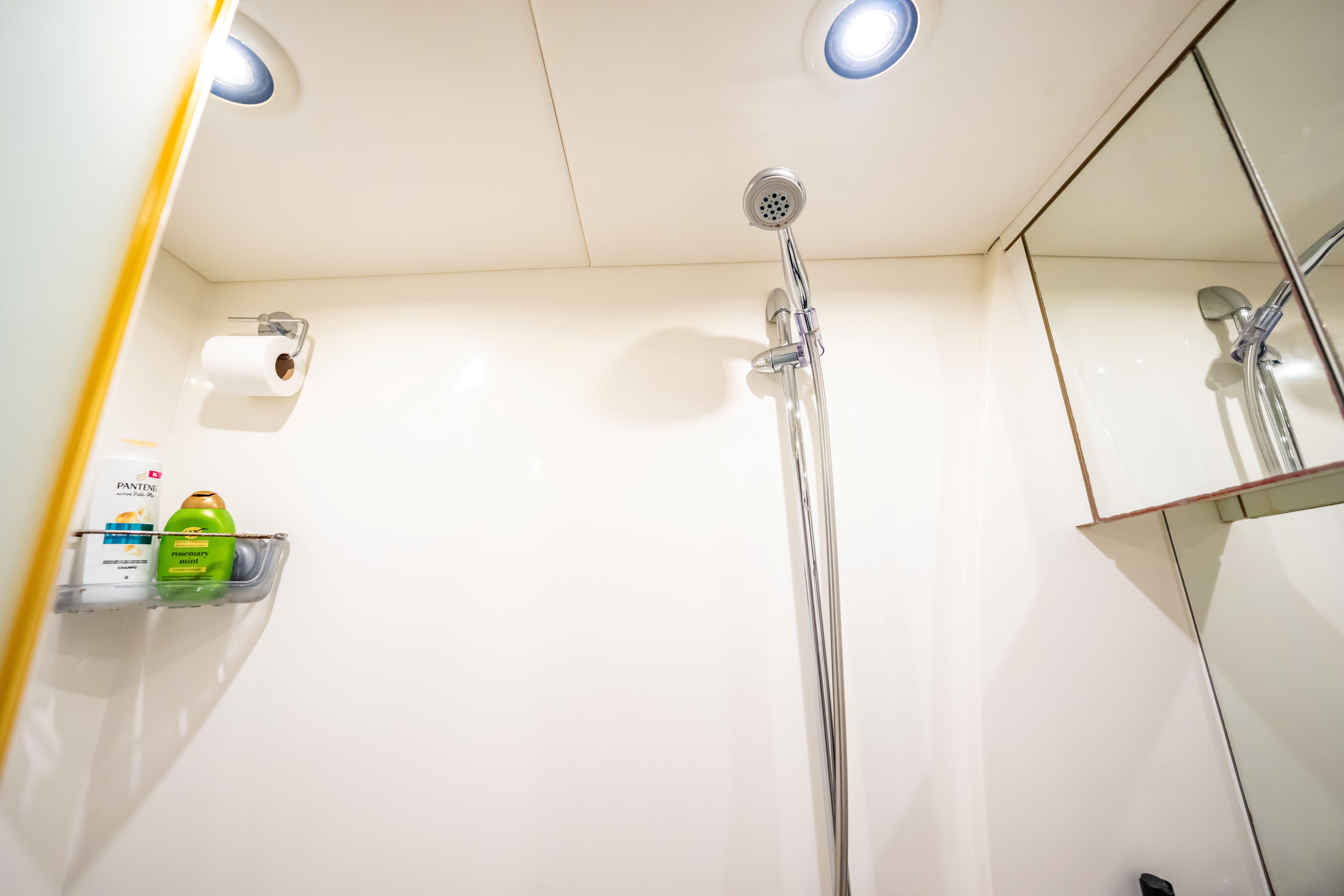 Shower area in 2011 Sunseeker 34 Metre Yacht with toiletries and mirror.