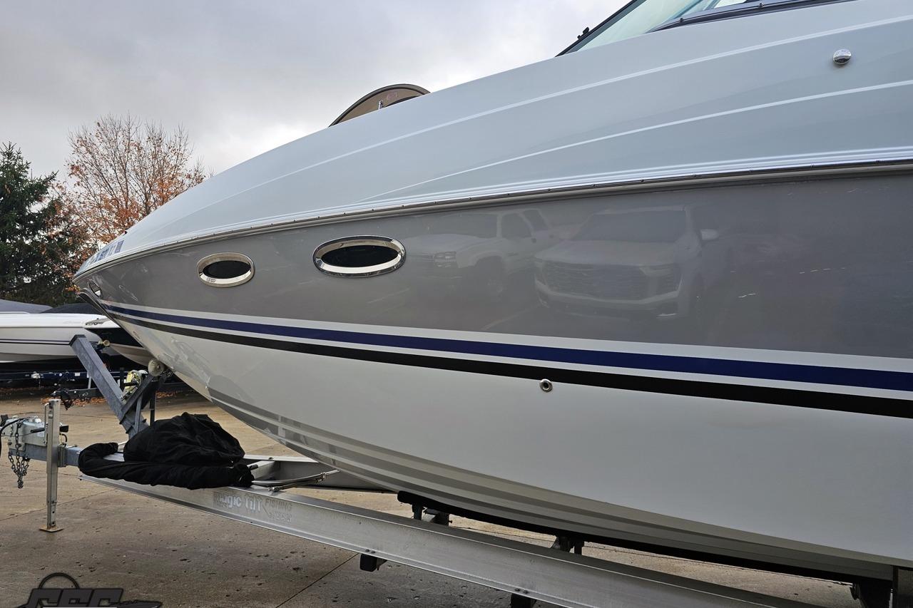 2008 Baja 335 Performance boat on trailer, showcasing sleek design and metallic finish.