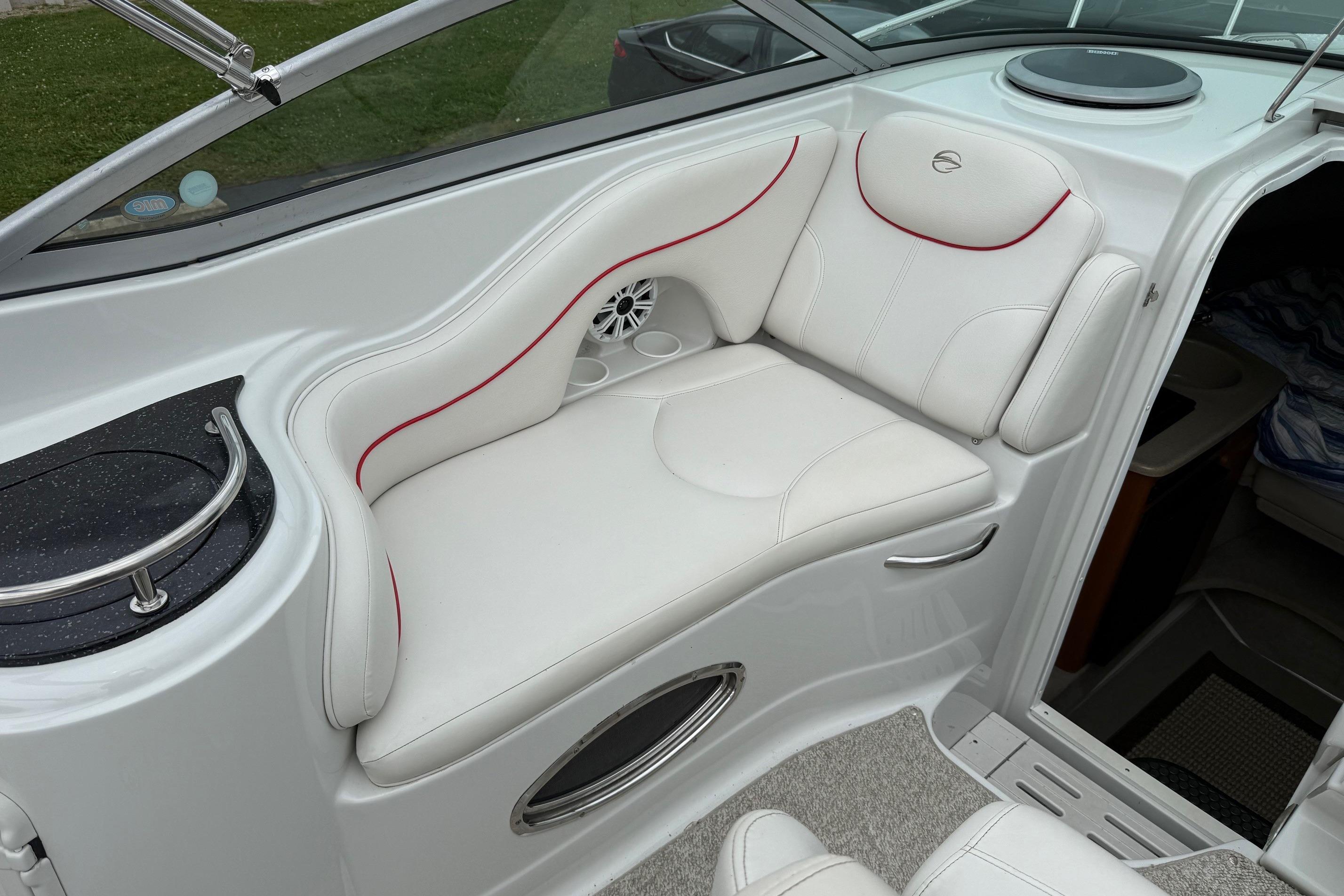 2005 Crownline 250 CR boat interior with white seating and red accents.