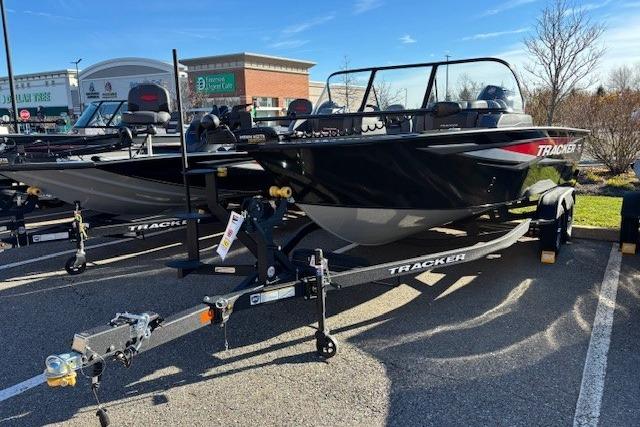 2026 Tracker Targa V-18 WT boat on trailer in parking lot.