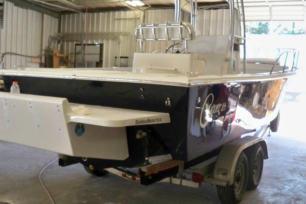 Manufacturer Provided Image: 2026 C-Hawk 26 Center Console boat on trailer in a garage.