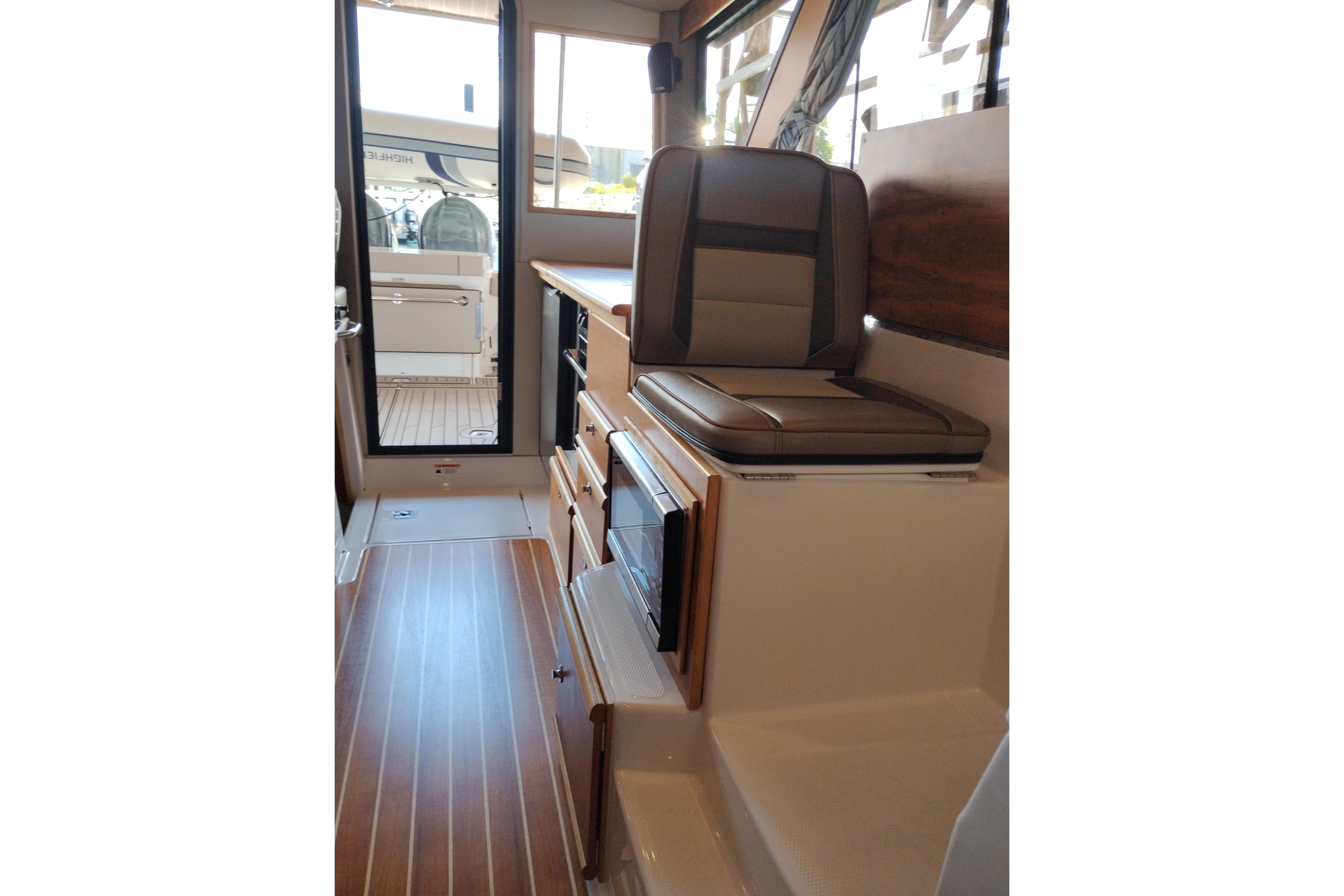 Interior of 2022 Cutwater C-32 Coupe, featuring seating and modern amenities.