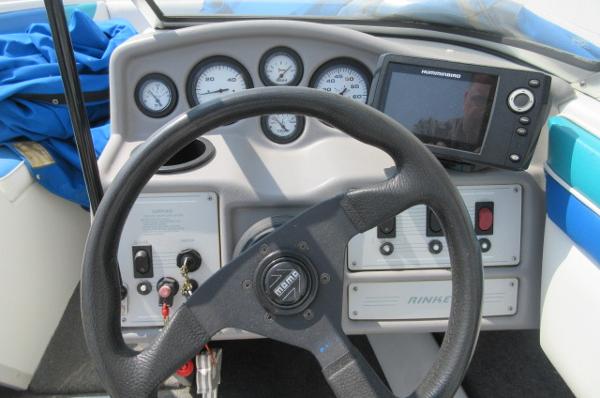 1993 Rinker 186 Captiva boat dashboard with steering wheel and gauges.