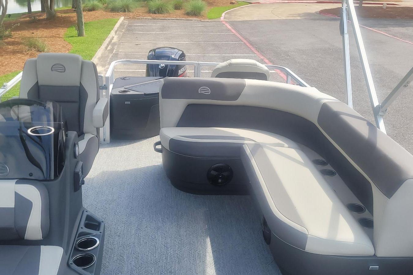2026 Sun Tracker Bass Buggy 18 DLX pontoon boat interior with seating and console.