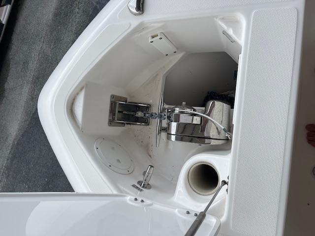 2014 Everglades 325 Center Console anchor compartment with winch and storage.