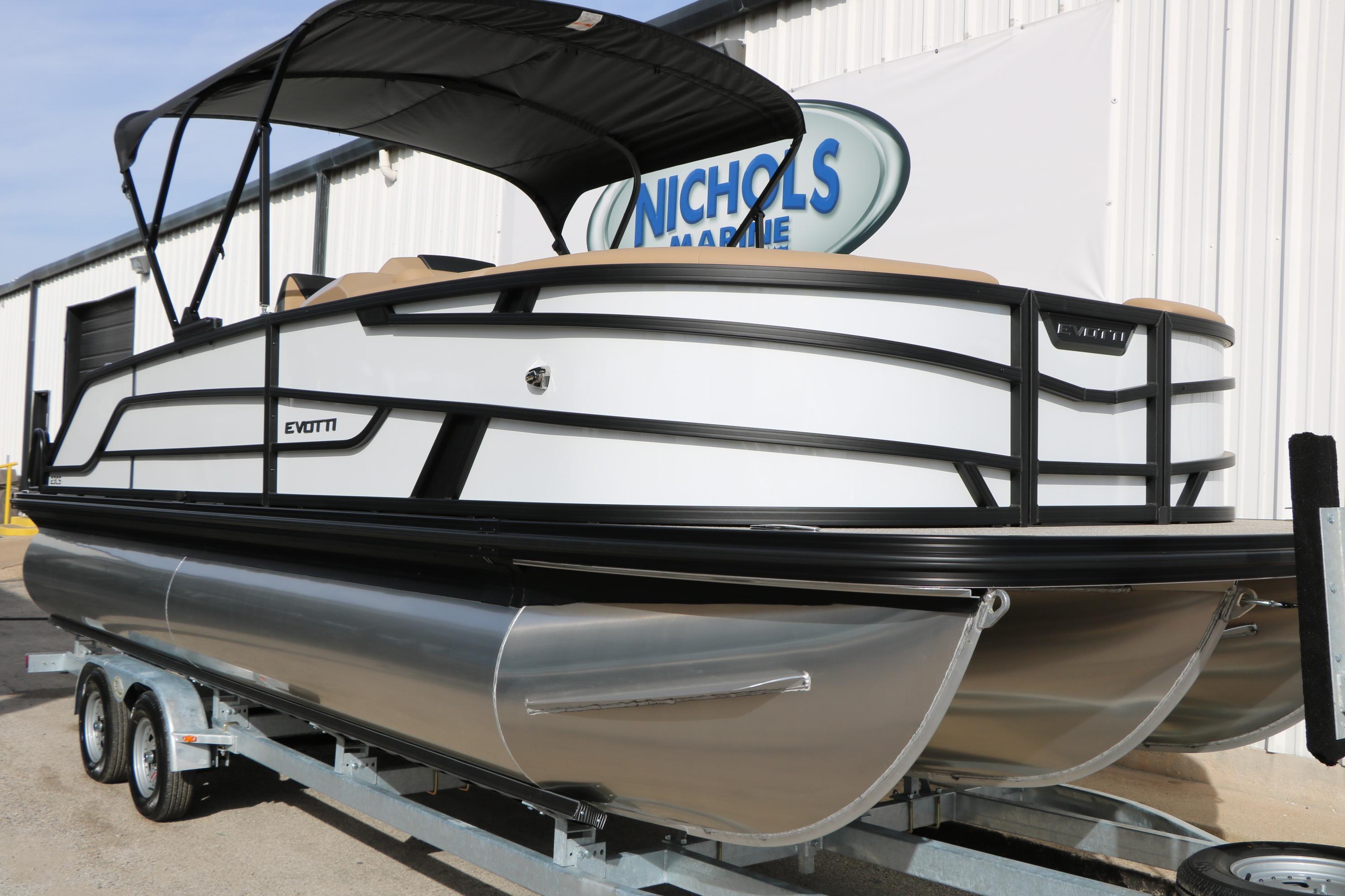 2026 Evotti 523CS pontoon boat on trailer, featuring sleek design and canopy.