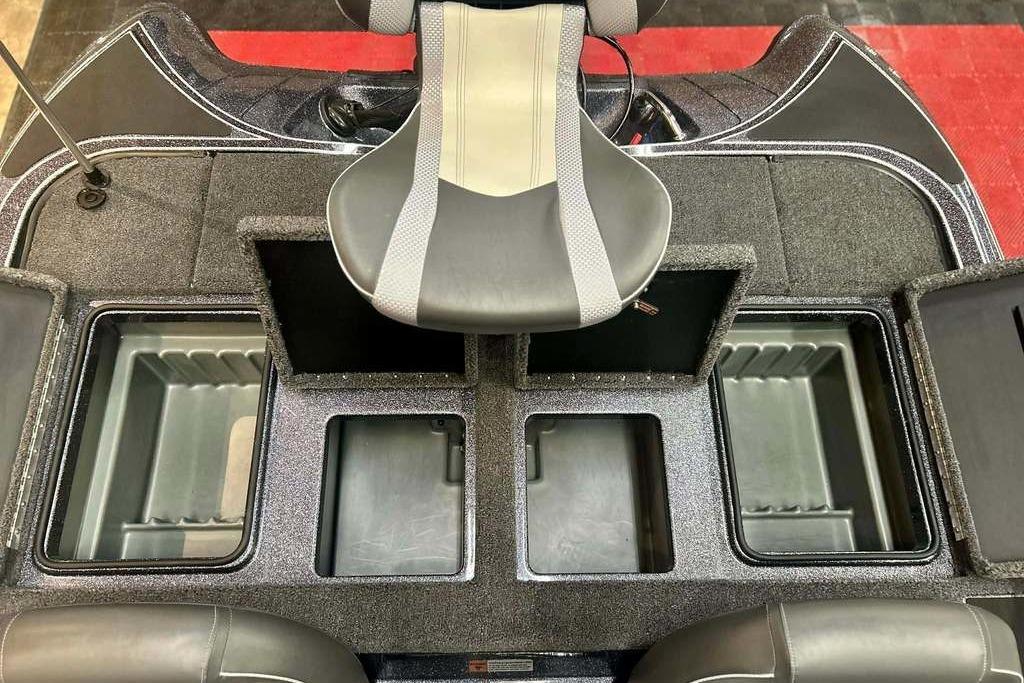 2026 Triton 18 TrX boat interior with storage compartments and seating.