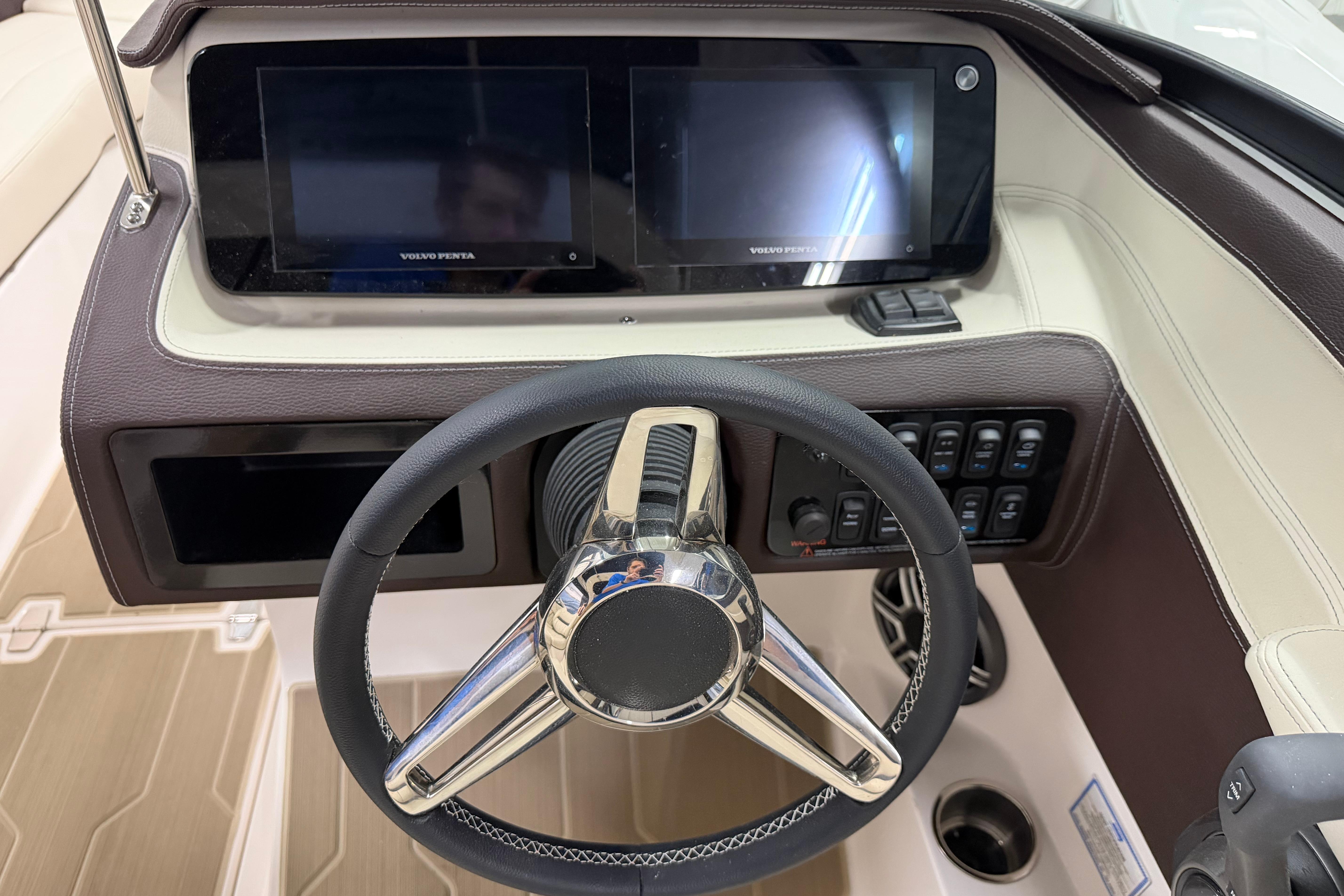 2026 Regal LS6 boat dashboard with dual screens and steering wheel.
