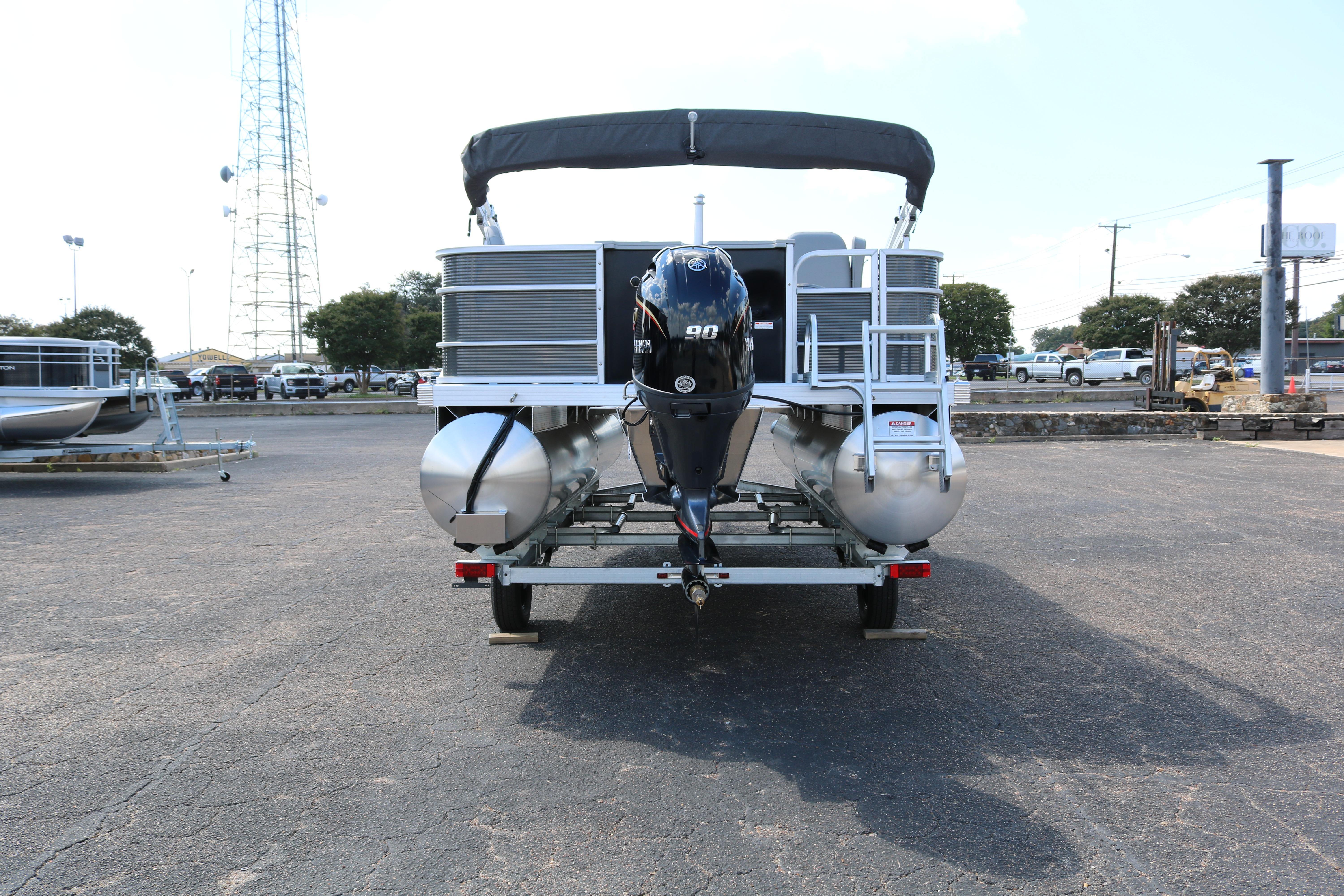 2026 Bennington 20SXSNP REAR FISH pontoon boat on trailer, rear view.