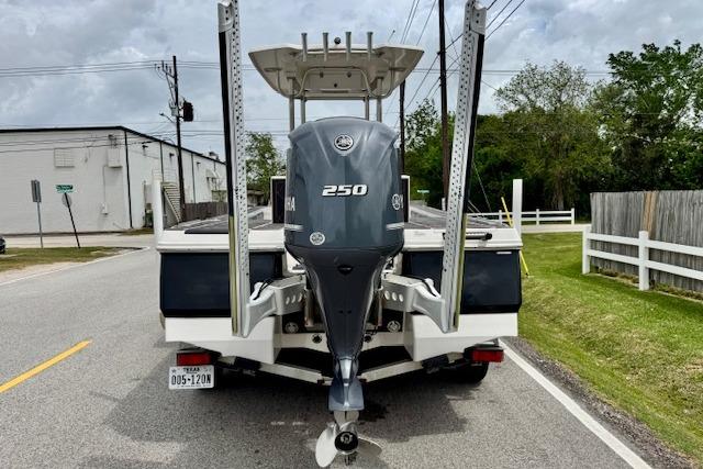 2015 Robalo 226 Cayman boat with Yamaha 250 engine on a road.