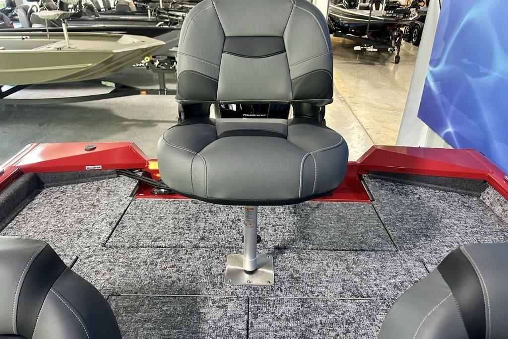2026 Tracker Pro Team 195 boat interior with gray seating and carpeted flooring.