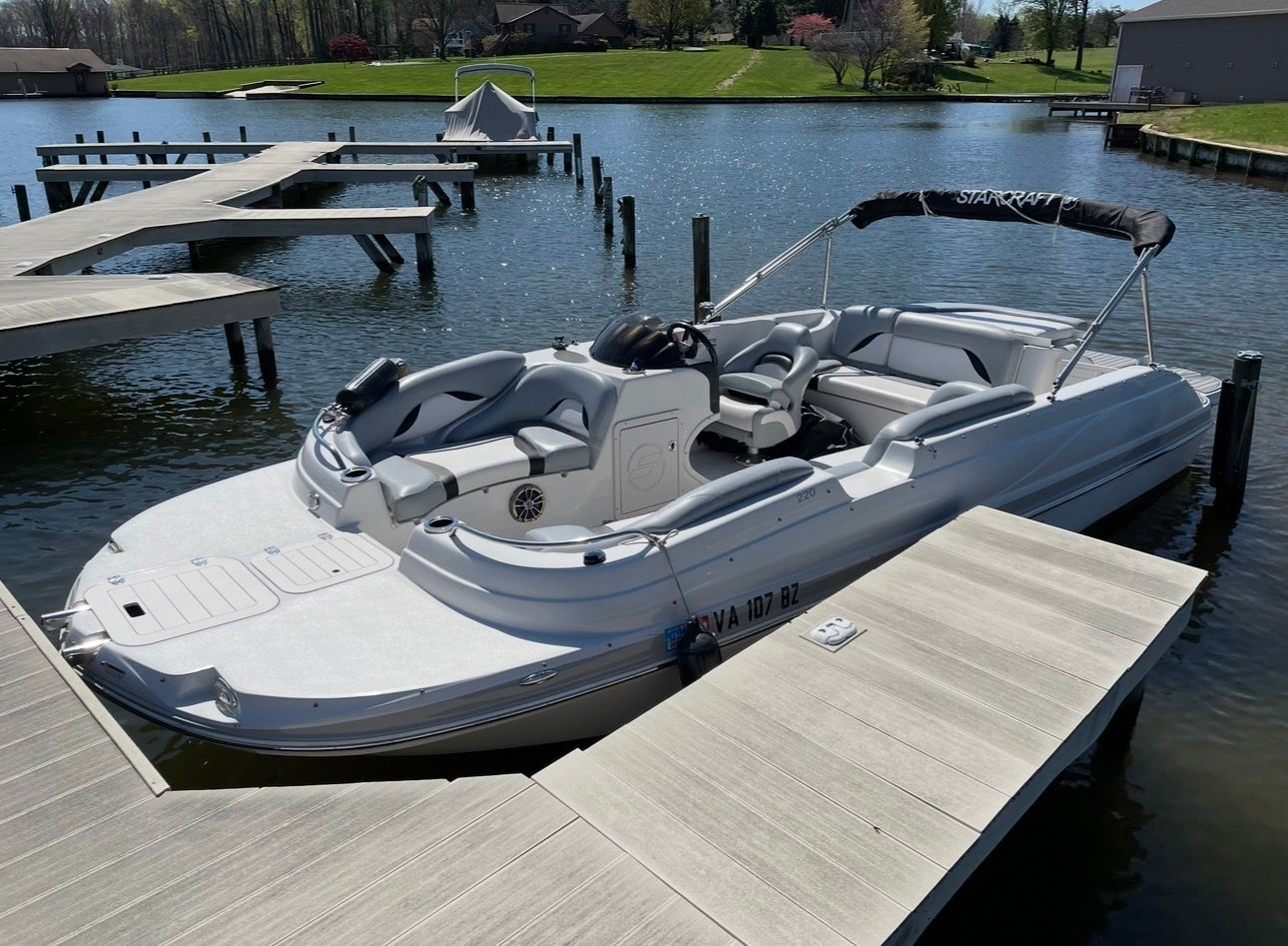 2015 Starcraft Star Step 220 I/O boat at dock.