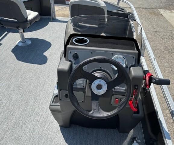 Steering console of 2026 Sun Tracker Bass Buggy 18 DLX pontoon boat.