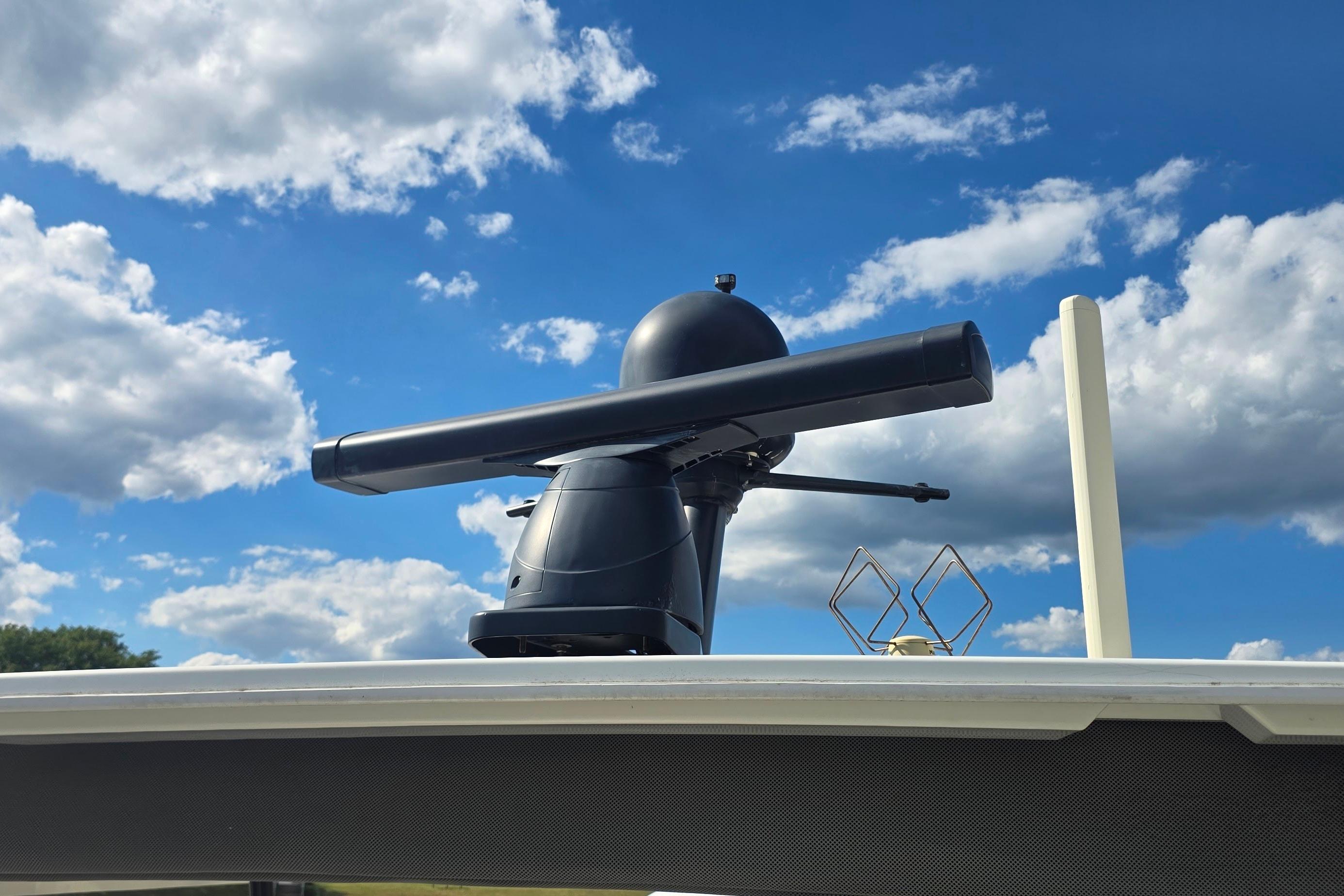 Radar equipment on 2018 Fountaine Pajot Motor Yacht 44 against a cloudy blue sky.