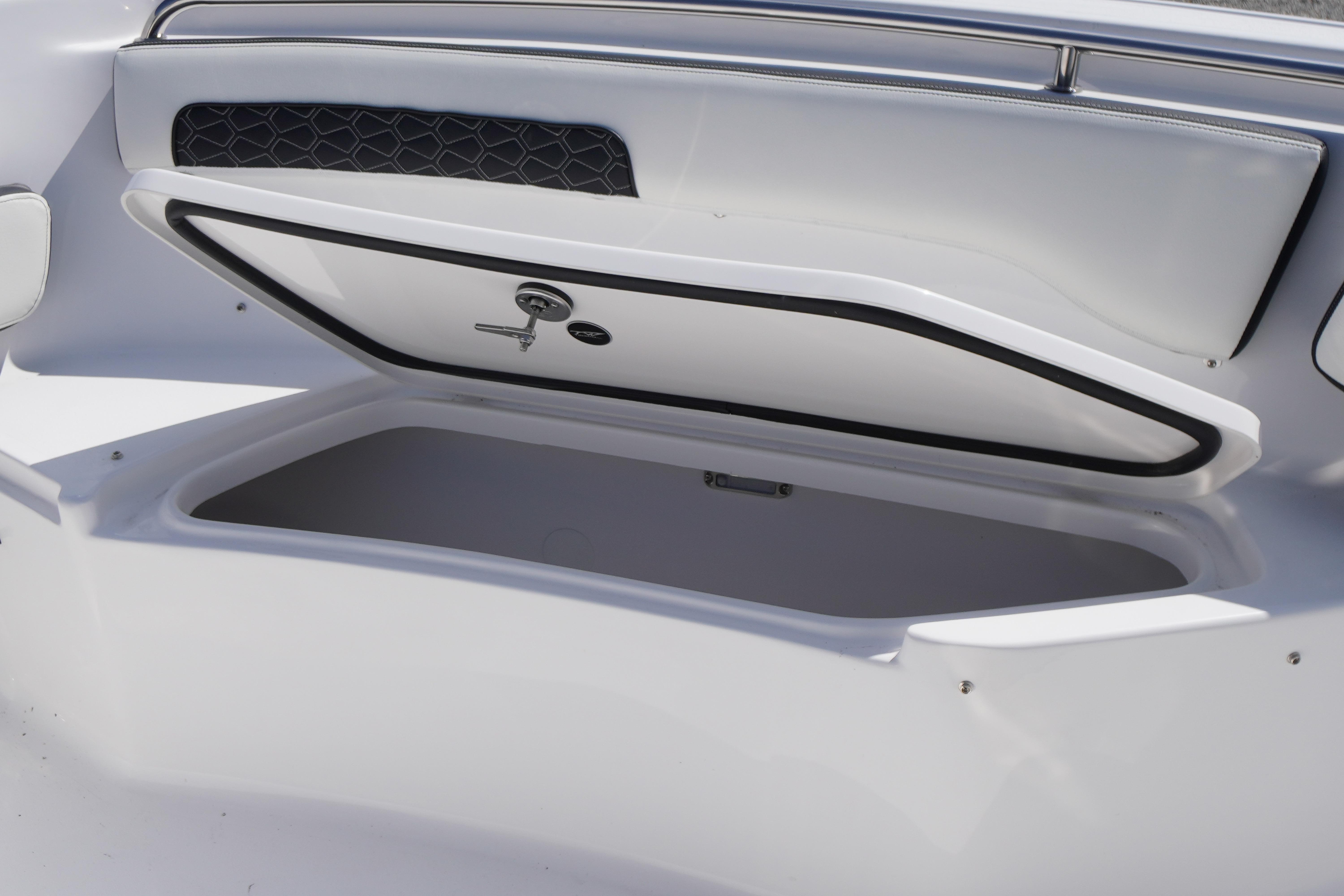 Open storage compartment on 2026 Tidewater 220 CC Adventure boat.