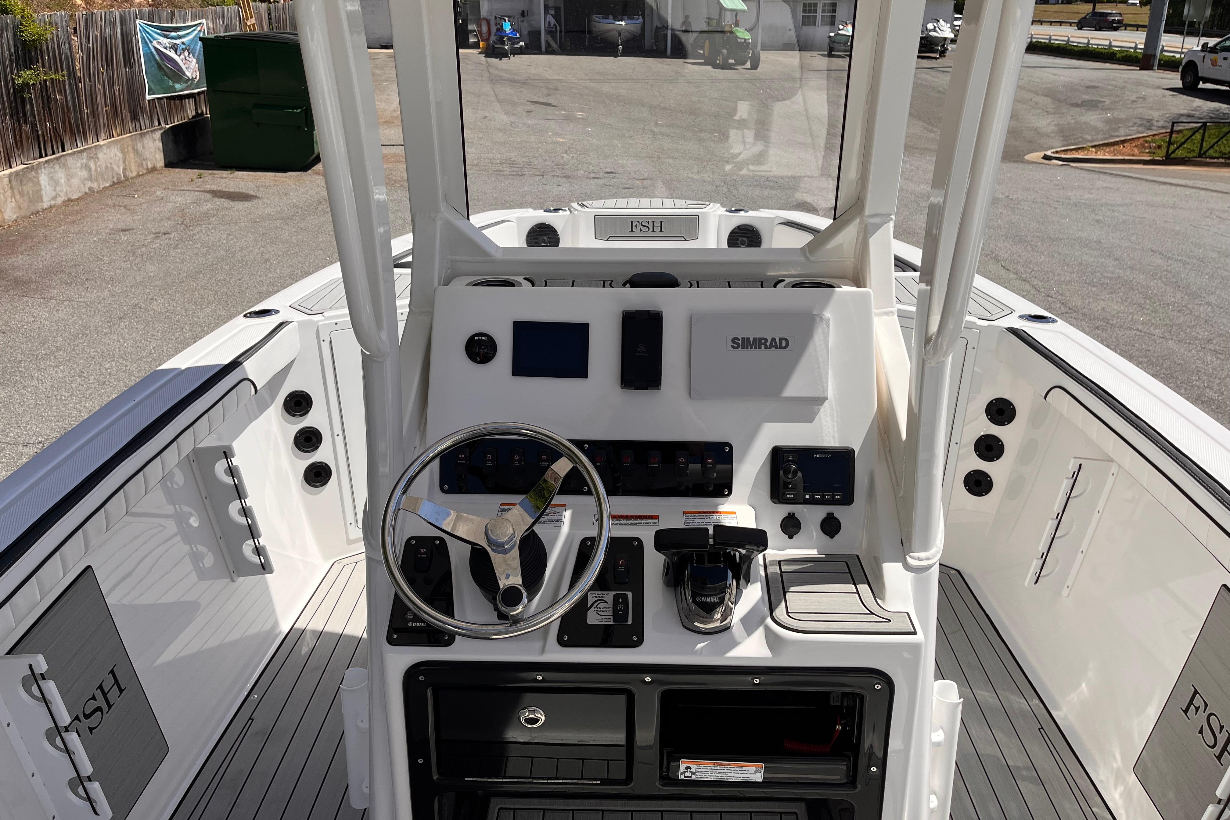2026 Yamaha Boats 222 FSH Sport E dashboard with steering wheel and controls.