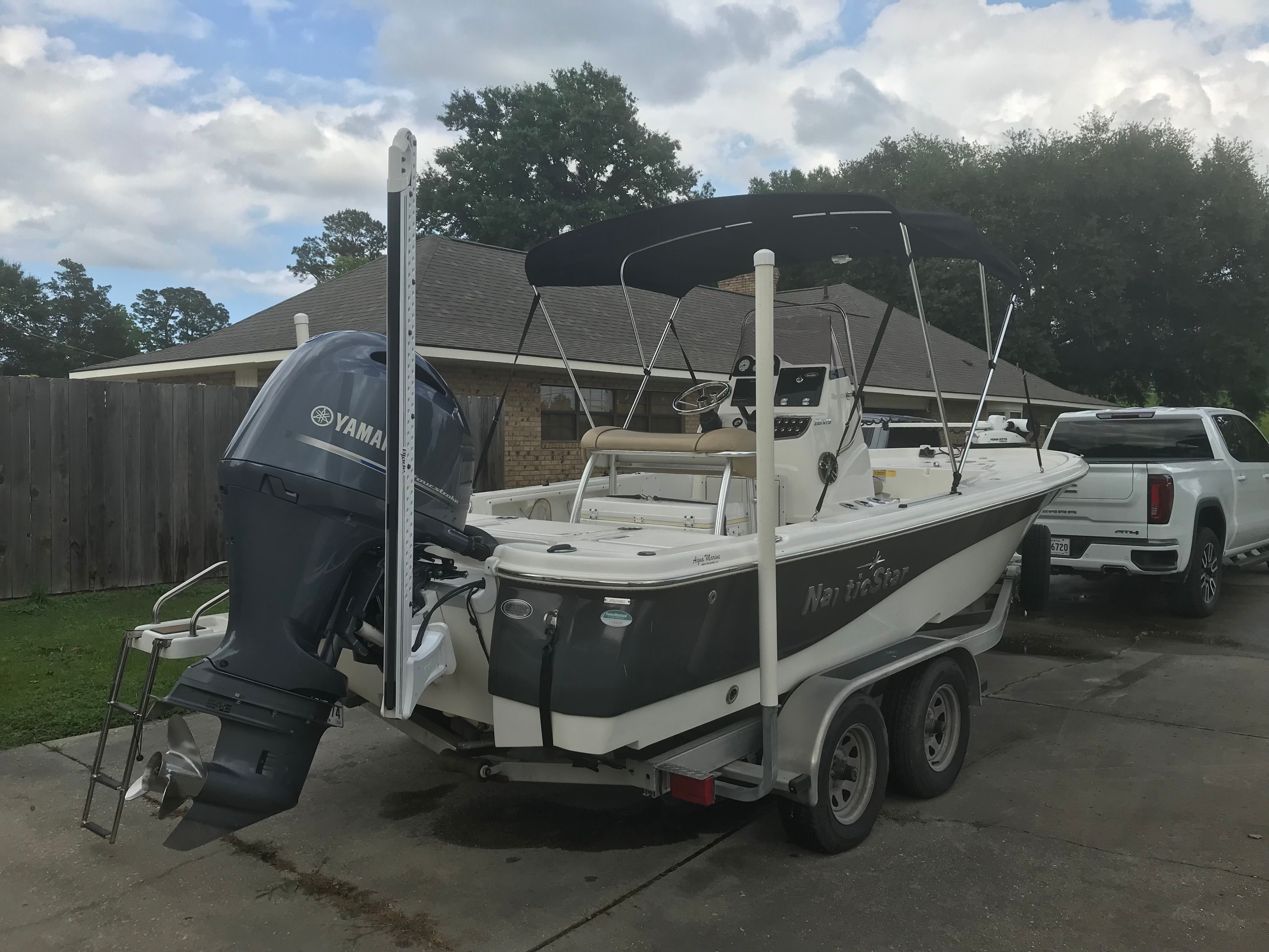 2020 NauticStar 215 XTS boat with Yamaha engine on trailer.