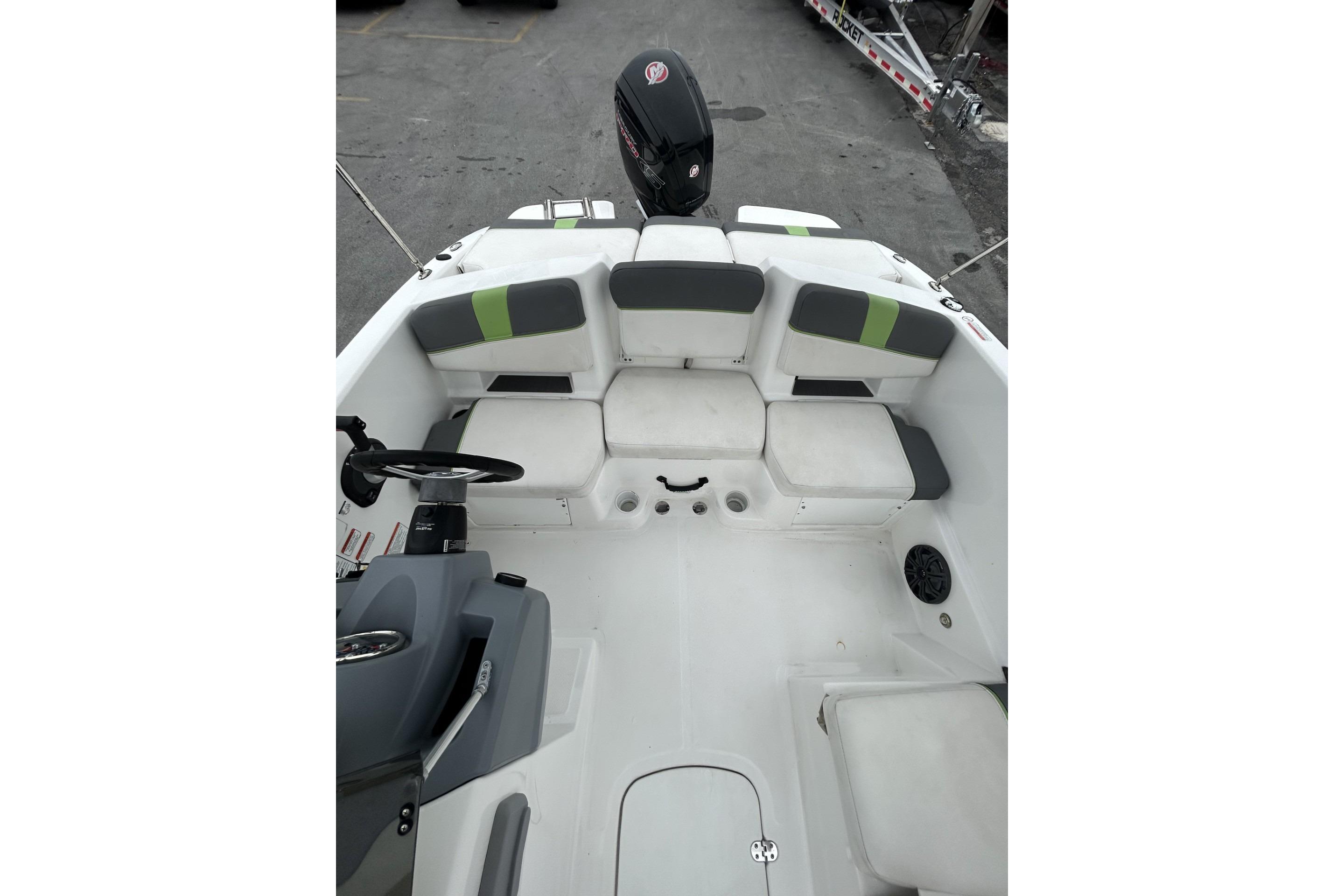 2022 Tahoe T18 boat interior with cushioned seating and steering console.