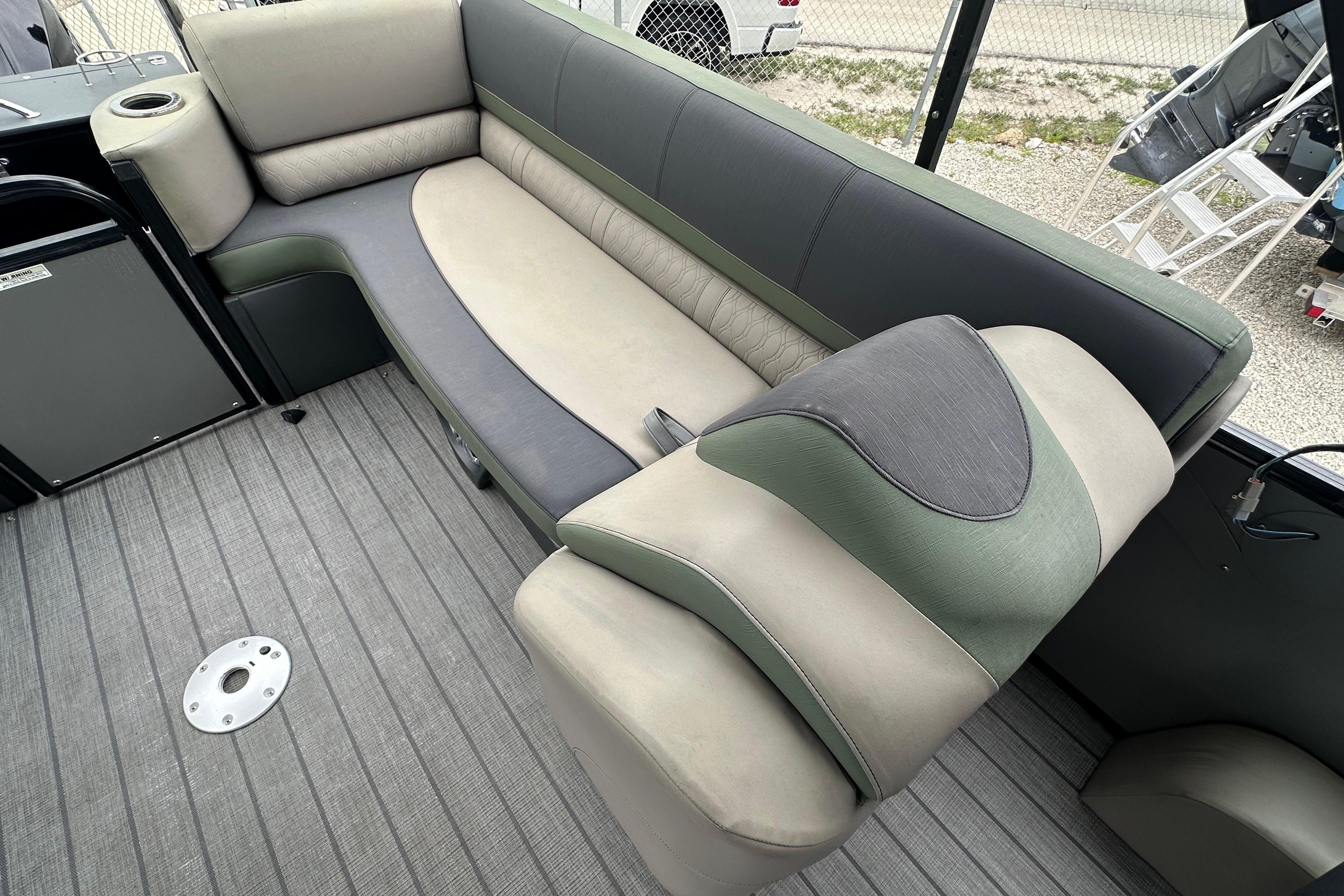 2023 Avalon Catalina Quad Lounge boat interior with plush seating and modern design.