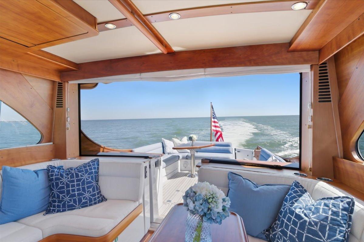 Luxurious interior of 2015 Hinckley Talaria 43 yacht with ocean view.