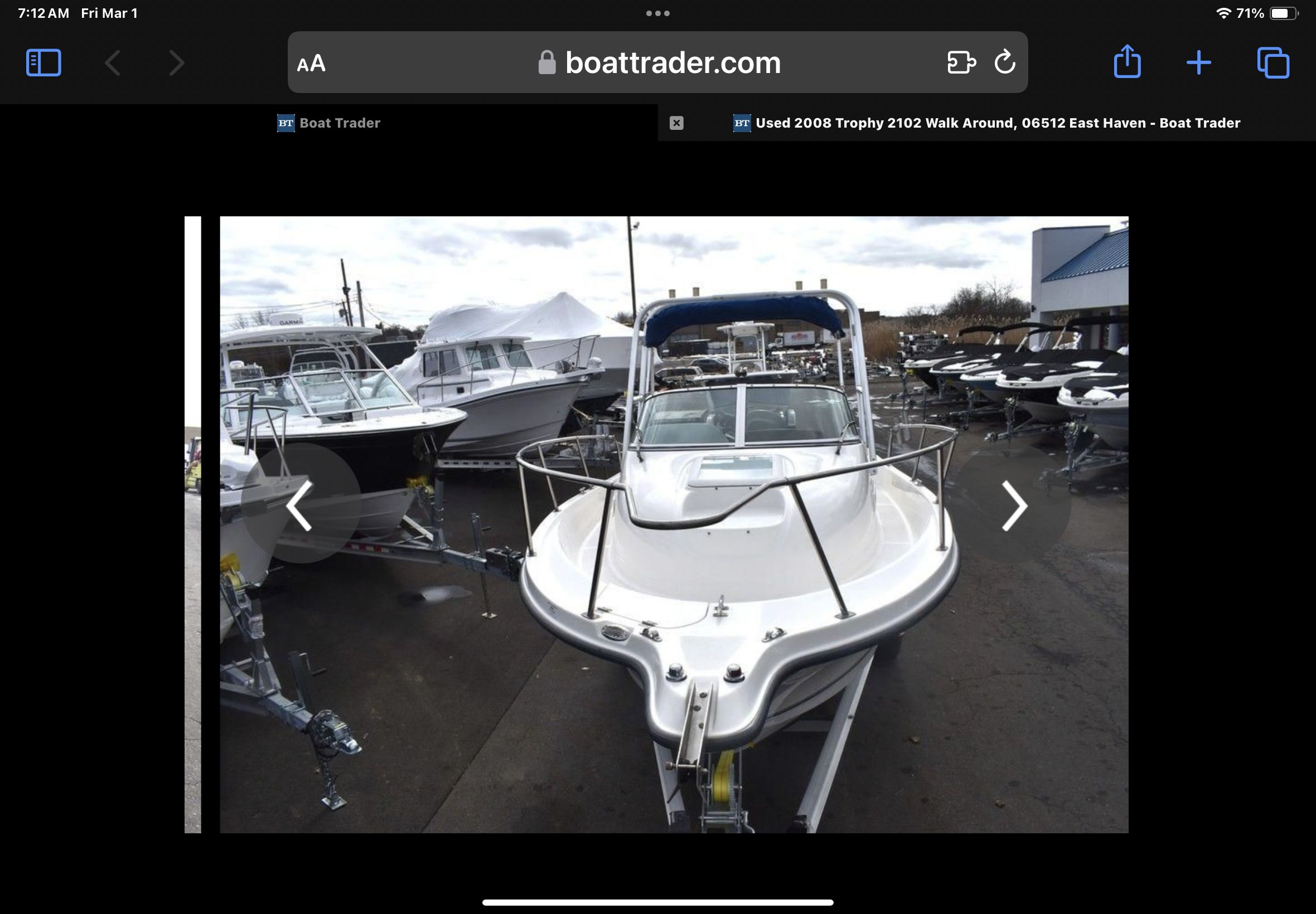 2008 Trophy 22 WA boat on a trailer outdoors.