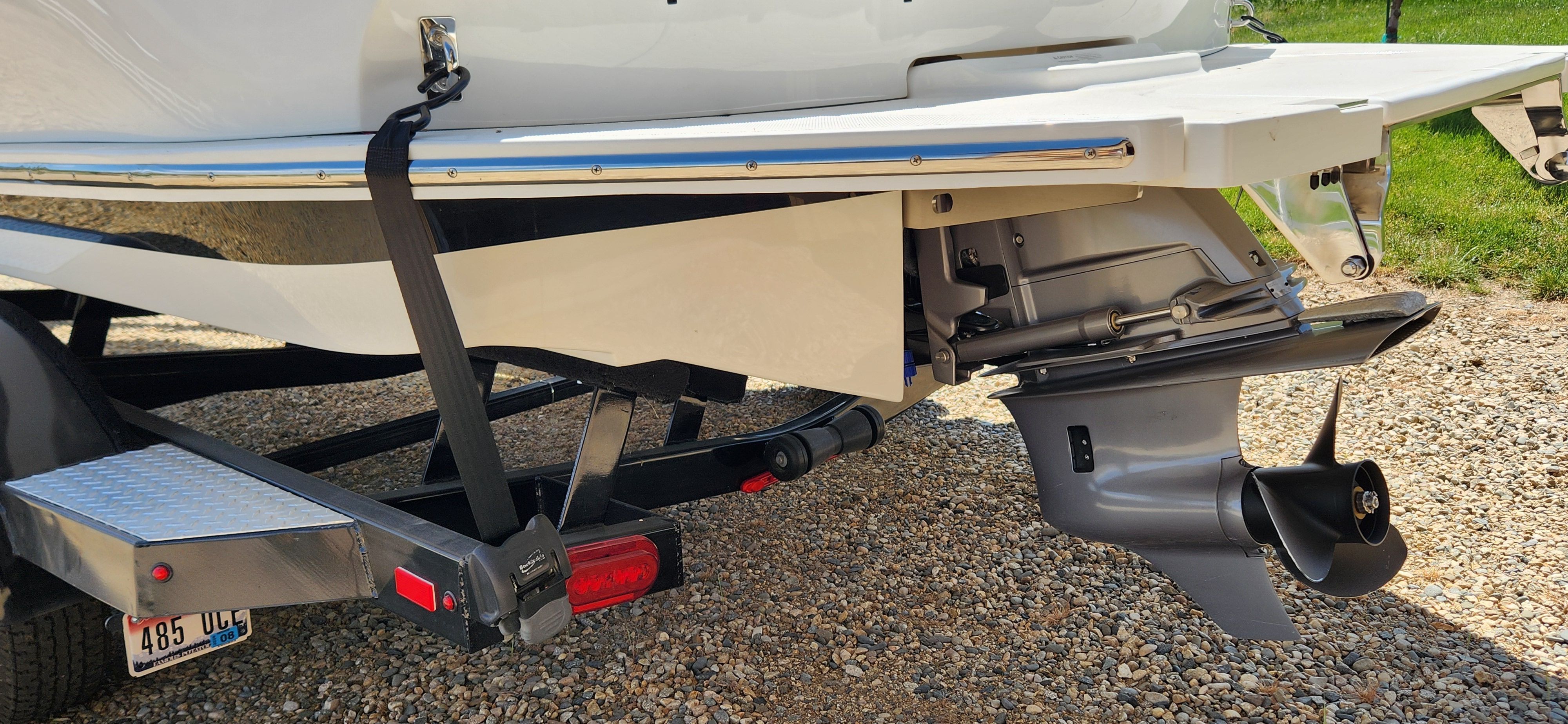 The image shows the rear of a Cobalt CS22 boat on a trailer.