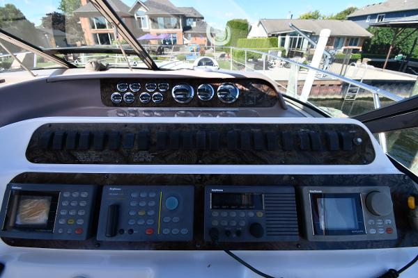 Control panel of a 1997 Sea Ray 400 Sundancer yacht, featuring navigation instruments.