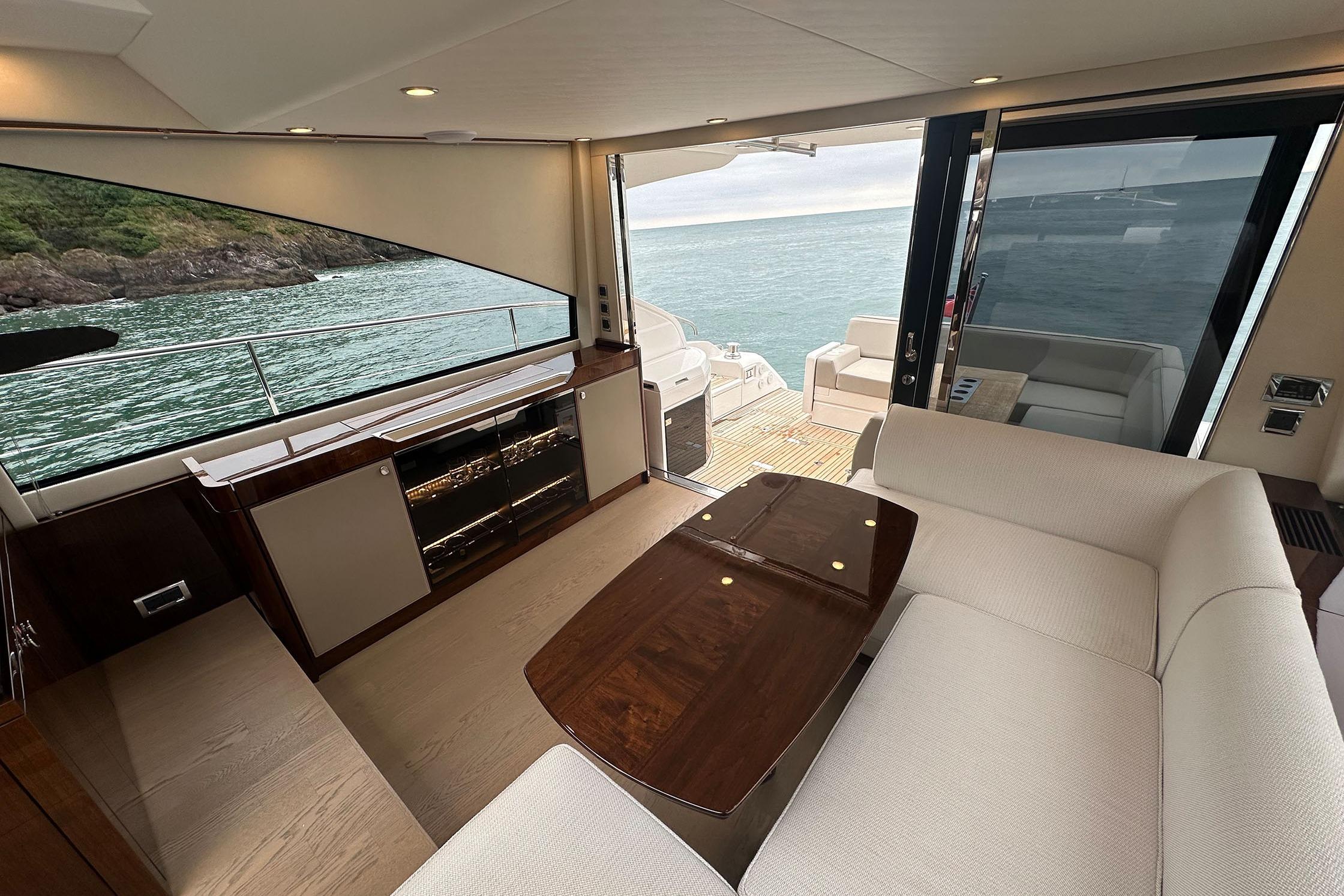 Interior of 2022 Fairline Targa 50 GT yacht with elegant seating and ocean view.