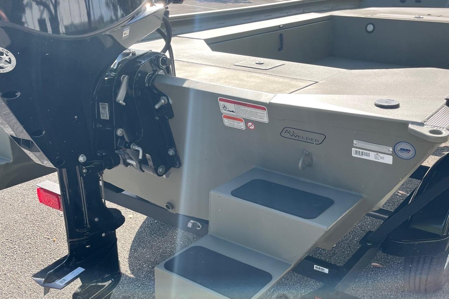 2026 Tracker Grizzly 1654 T Sportsman boat, rear view with motor and welded hull.