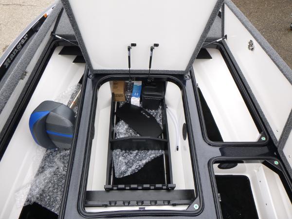 2025 Ranger Z521 boat storage compartment with open lid, showcasing interior space and equipment.