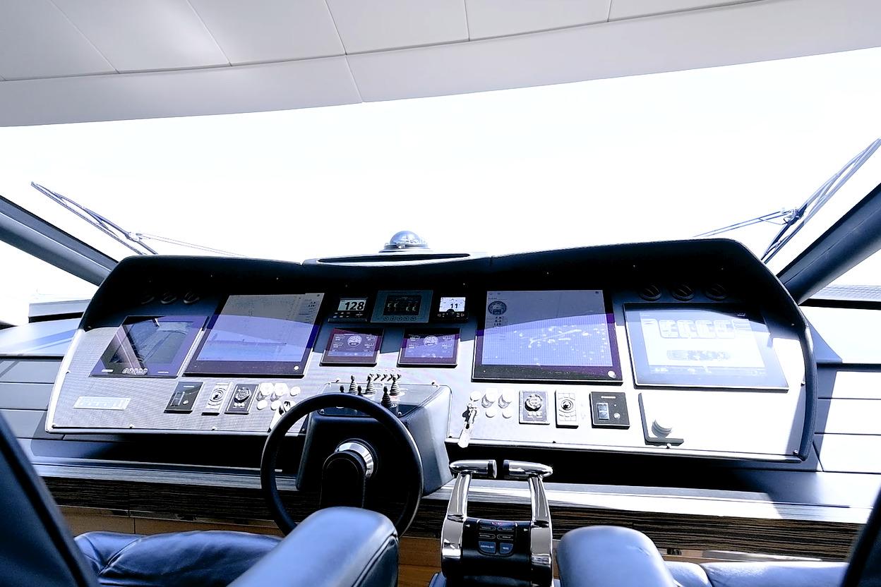 Cockpit of a 2015 Pershing 92 yacht with advanced navigation controls and displays.