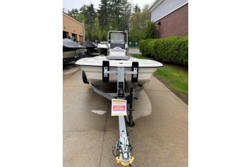 2025 Mako Pro Skiff 13 CC boat on trailer, parked outdoors.