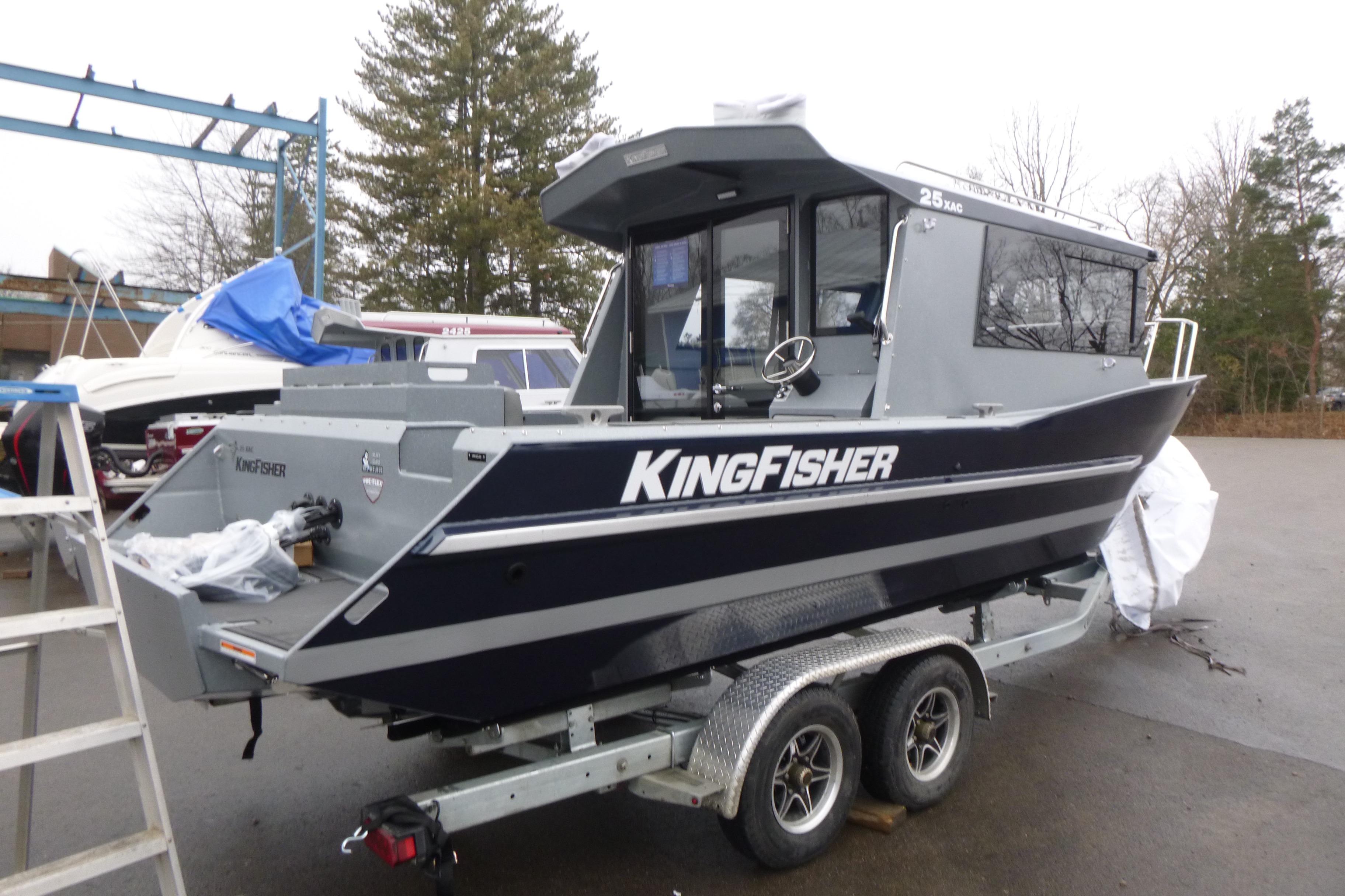2026 KingFisher 25 XAC boat on trailer, parked outdoors.