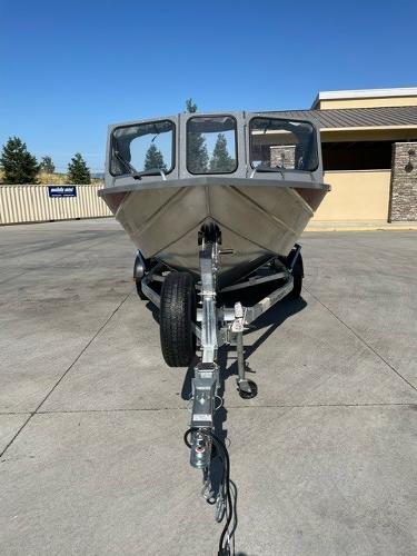 2025 Spartan 185 Astoria boat on trailer, parked outdoors on concrete surface.