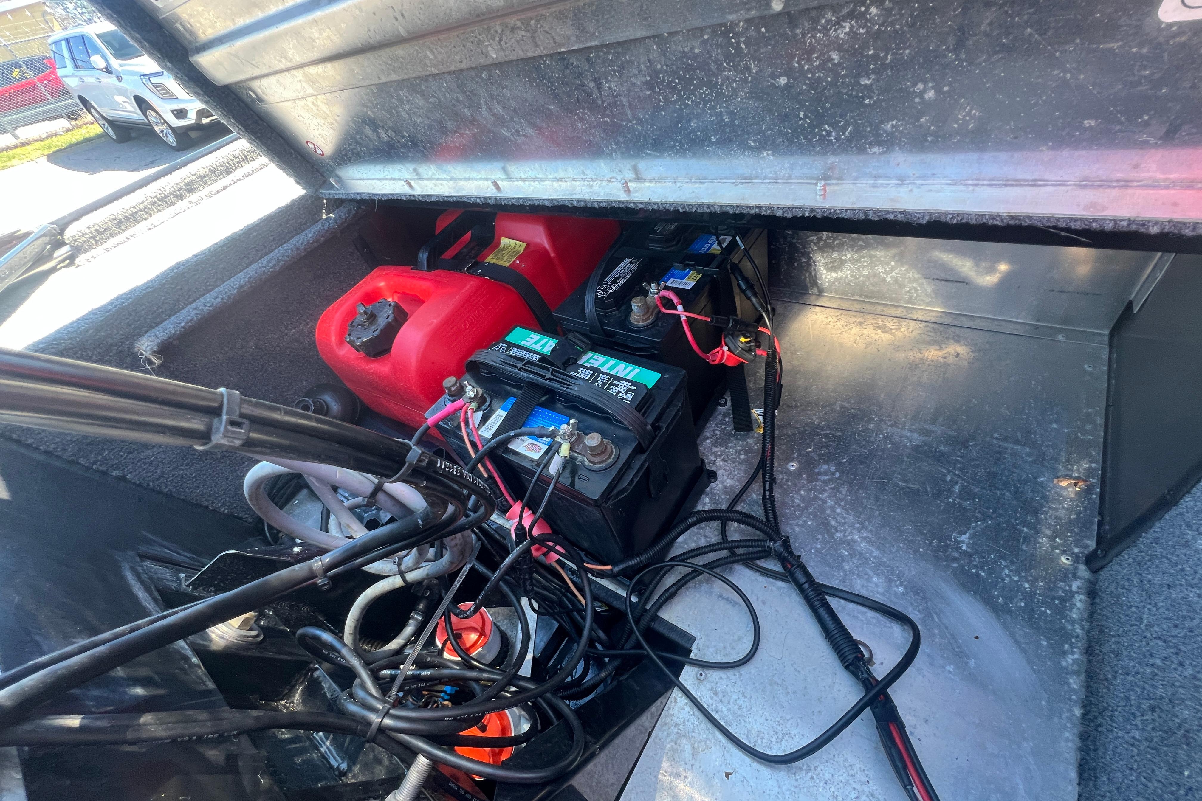 2023 Tracker Bass Tracker Classic XL boat battery and fuel compartment.