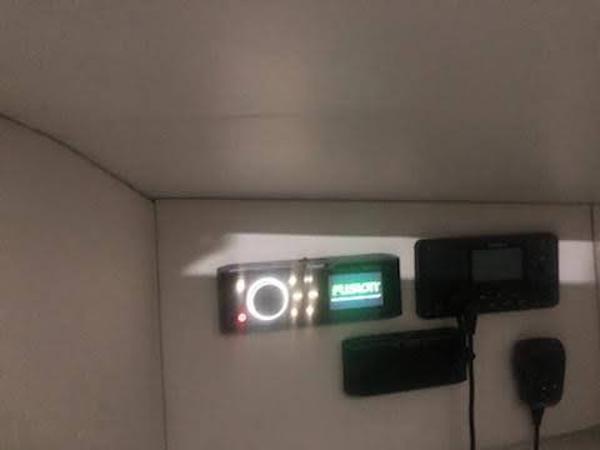 Control panel inside 2019 Midnight Express 39 Cuddy boat, featuring electronic displays and controls.