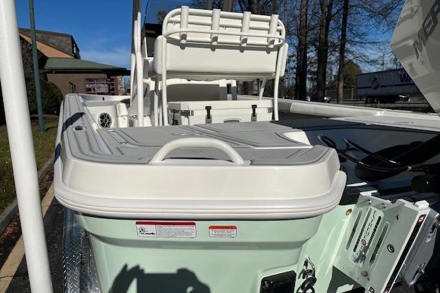 2026 Mako 24 APEX boat interior with seating and storage compartments.