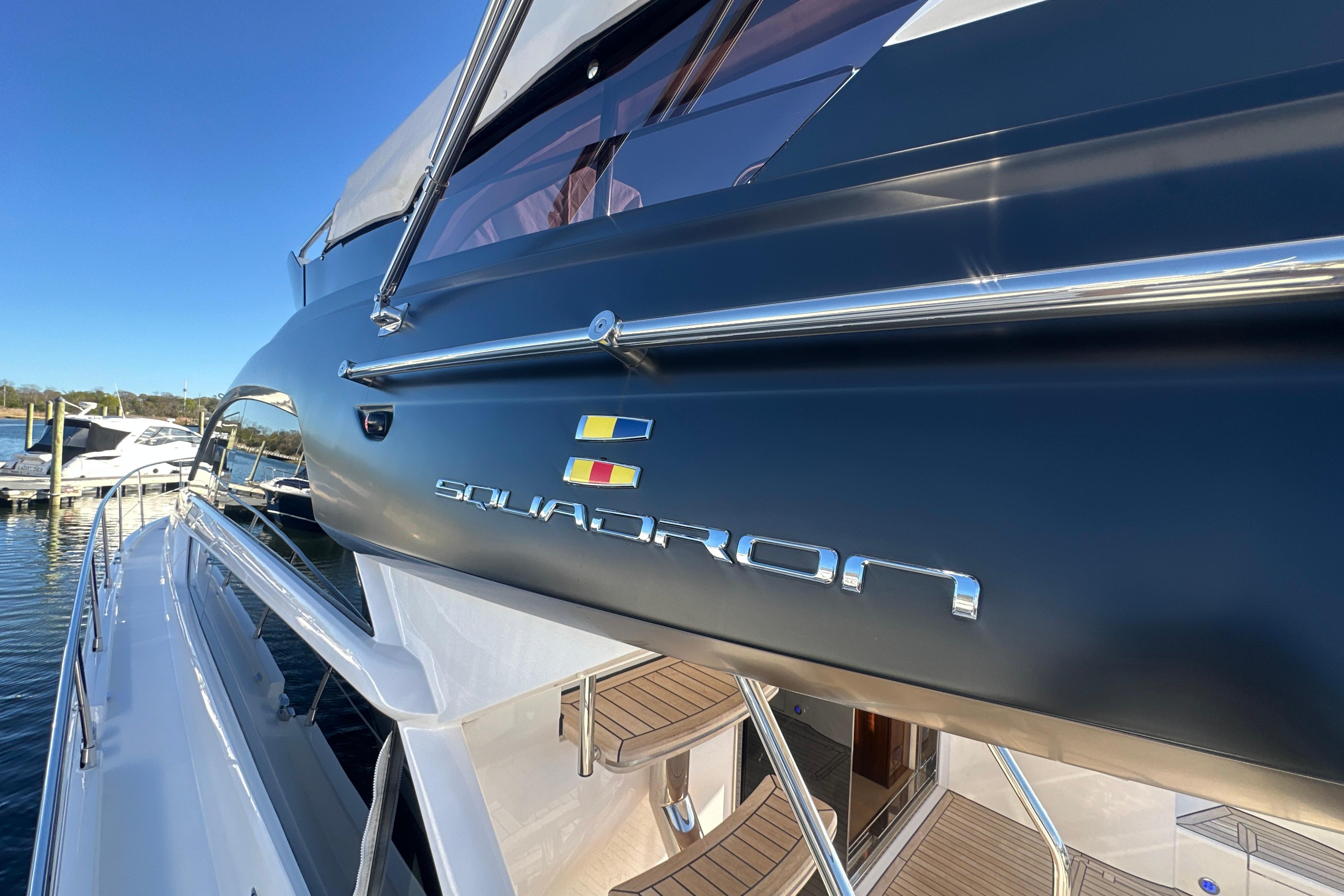 2024 Fairline Squadron 50 yacht, sleek design, docked at marina.
