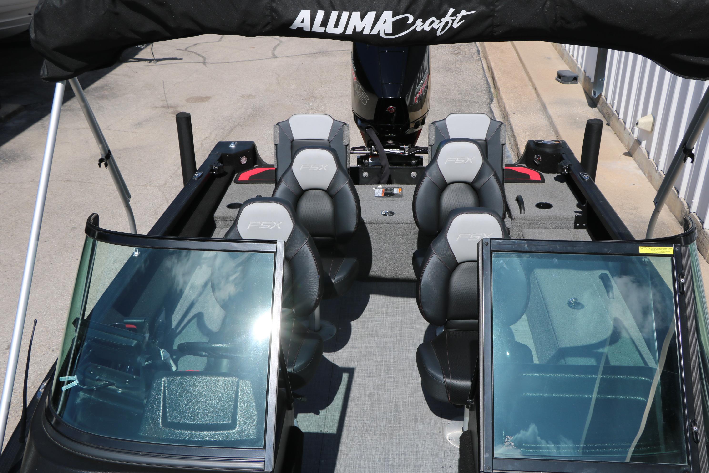 2023 Alumacraft Competitor FSX 185 boat interior with seating and windshield view.