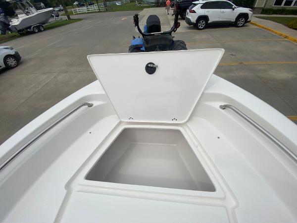 2024 Key West 189 FS boat with open storage compartment.