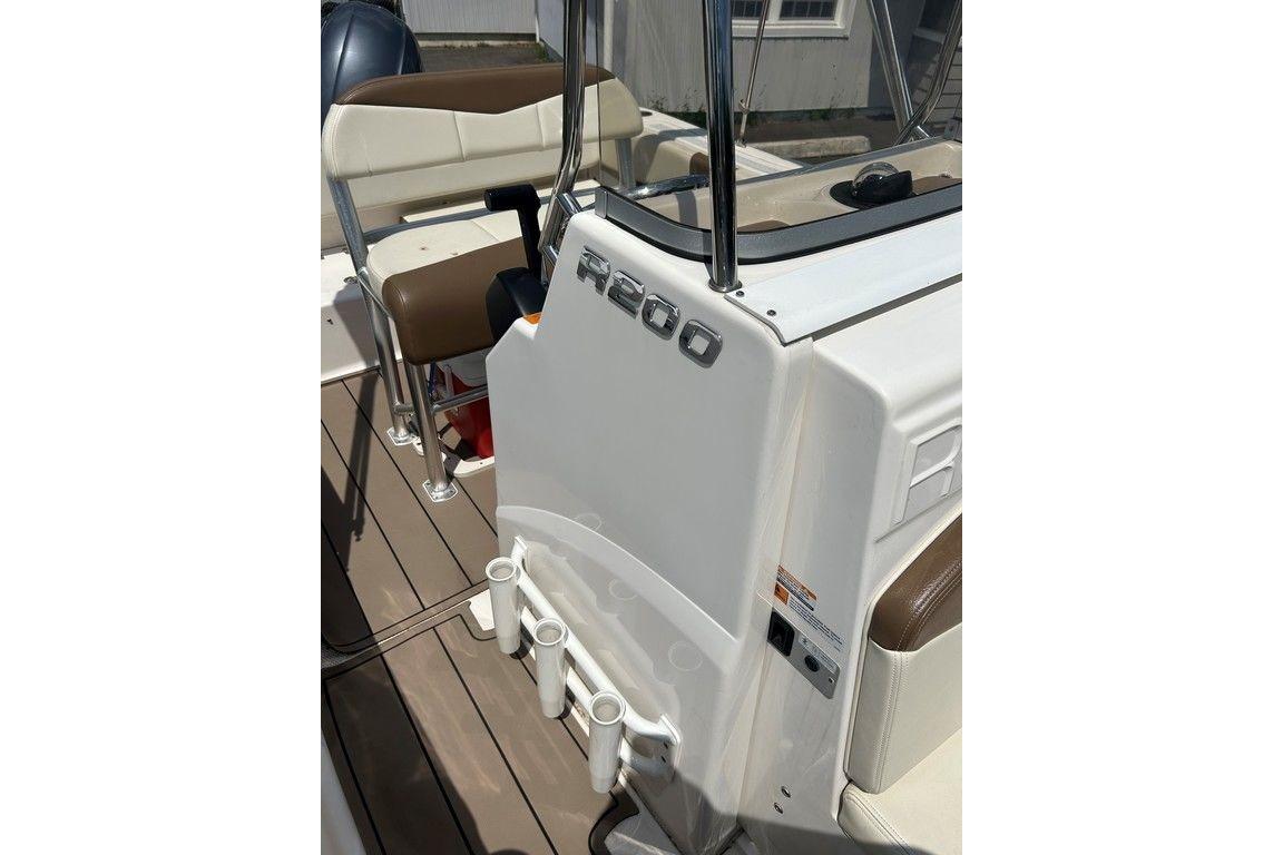 2017 Robalo R200ES boat interior with seating and rod holders.