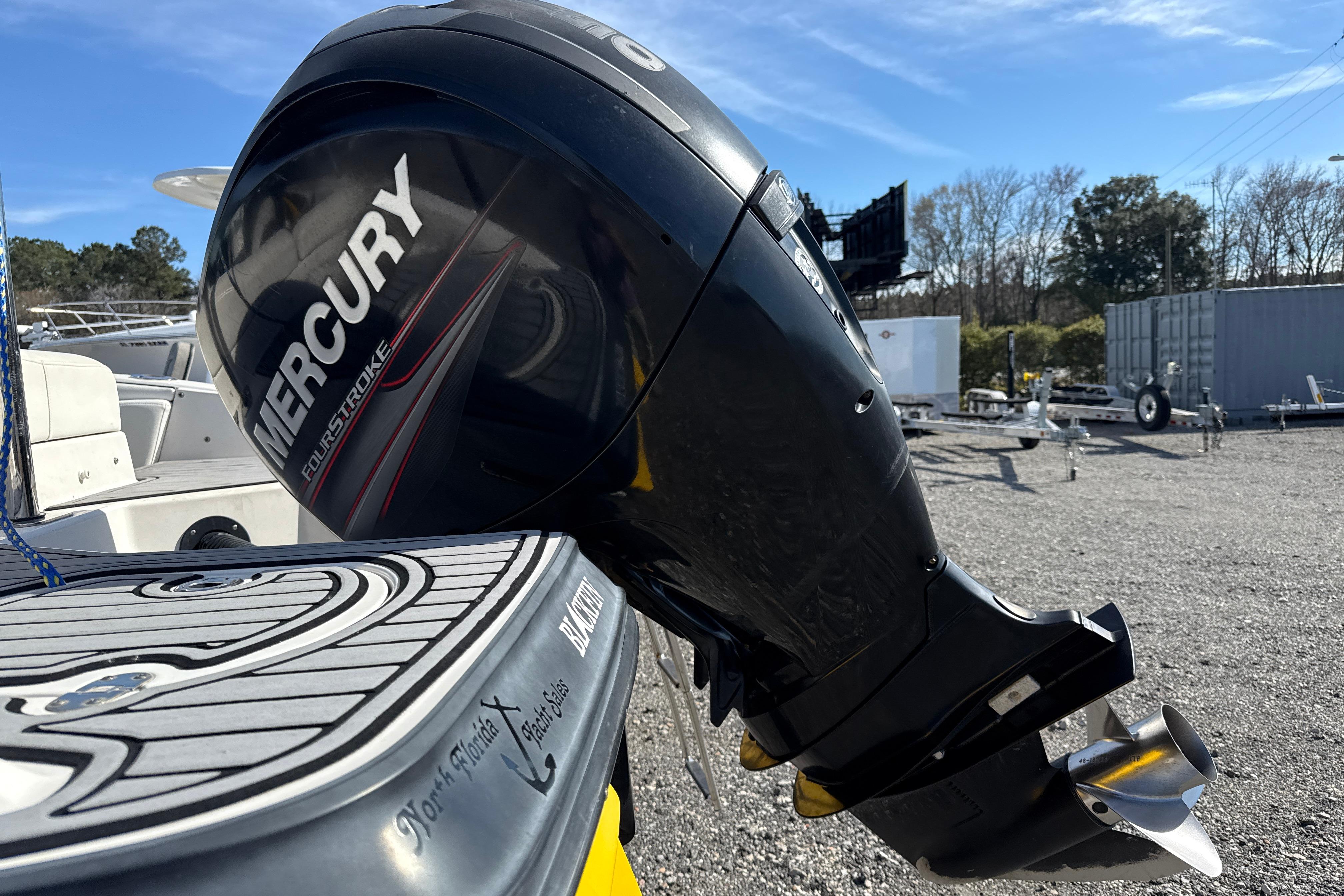 2014 Monterey 197 Blackfin with Mercury FourStroke outboard engine in a sunny outdoor setting.