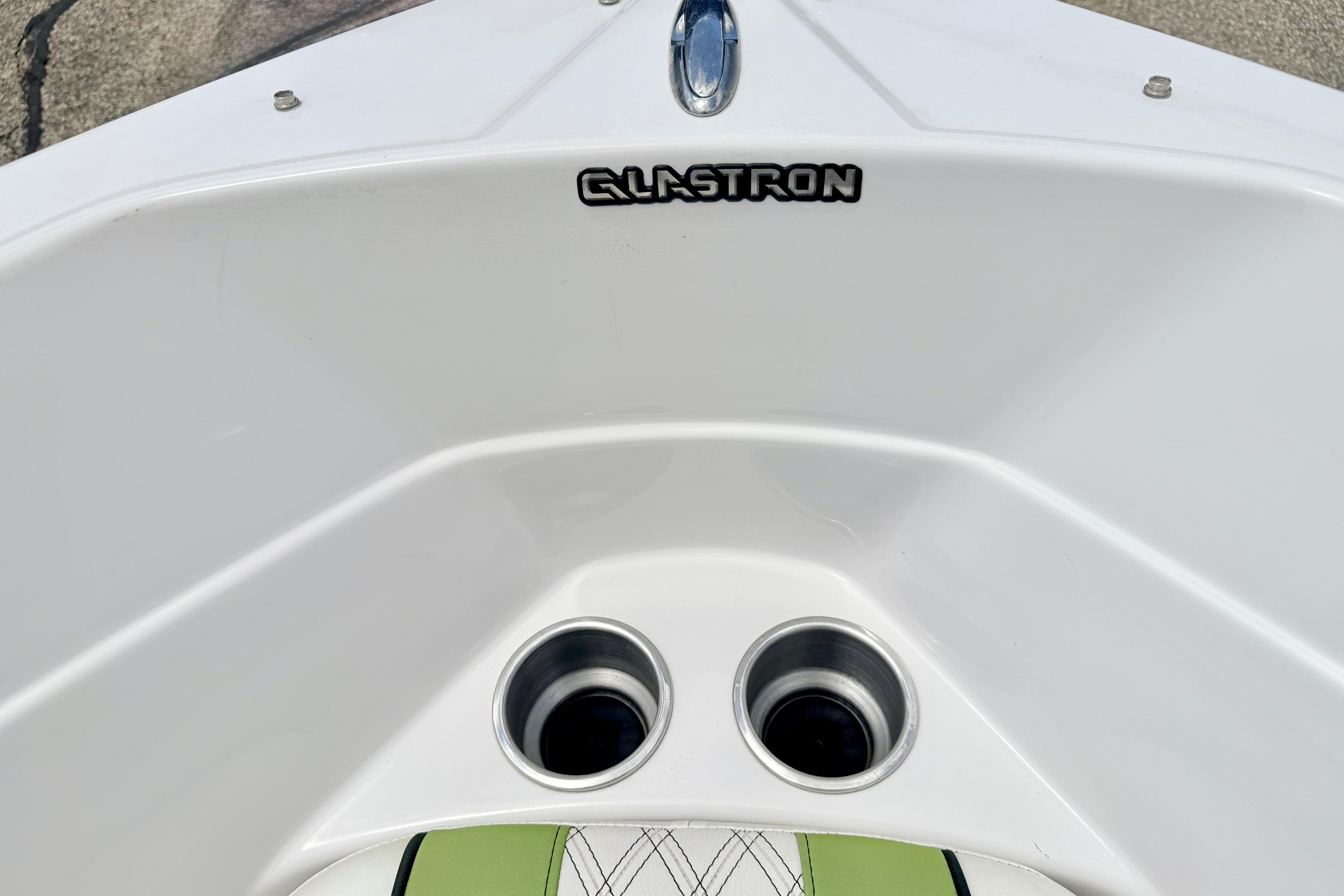 2018 Glastron GT 185 boat interior with cup holders and logo.